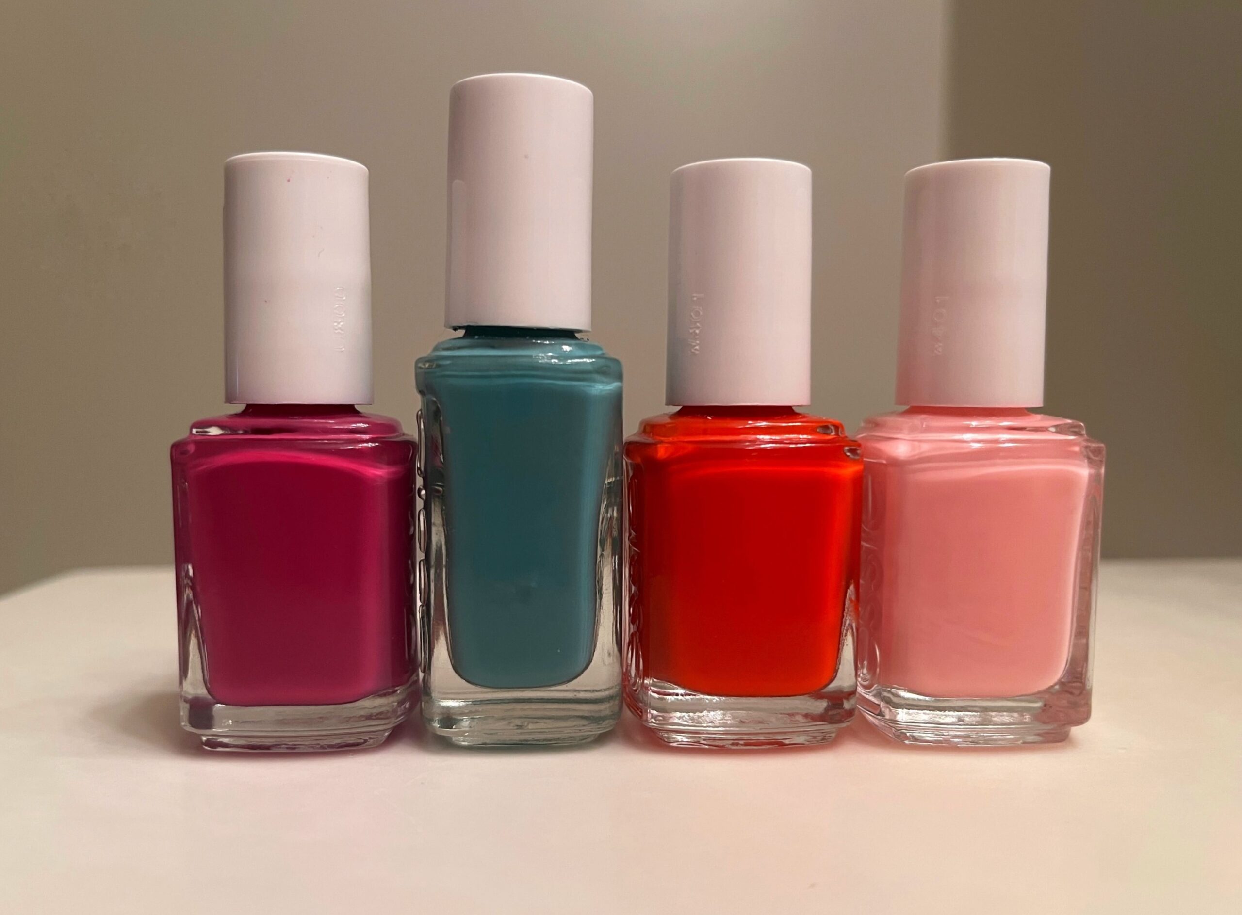Image of four bottles of nail polish on a counter