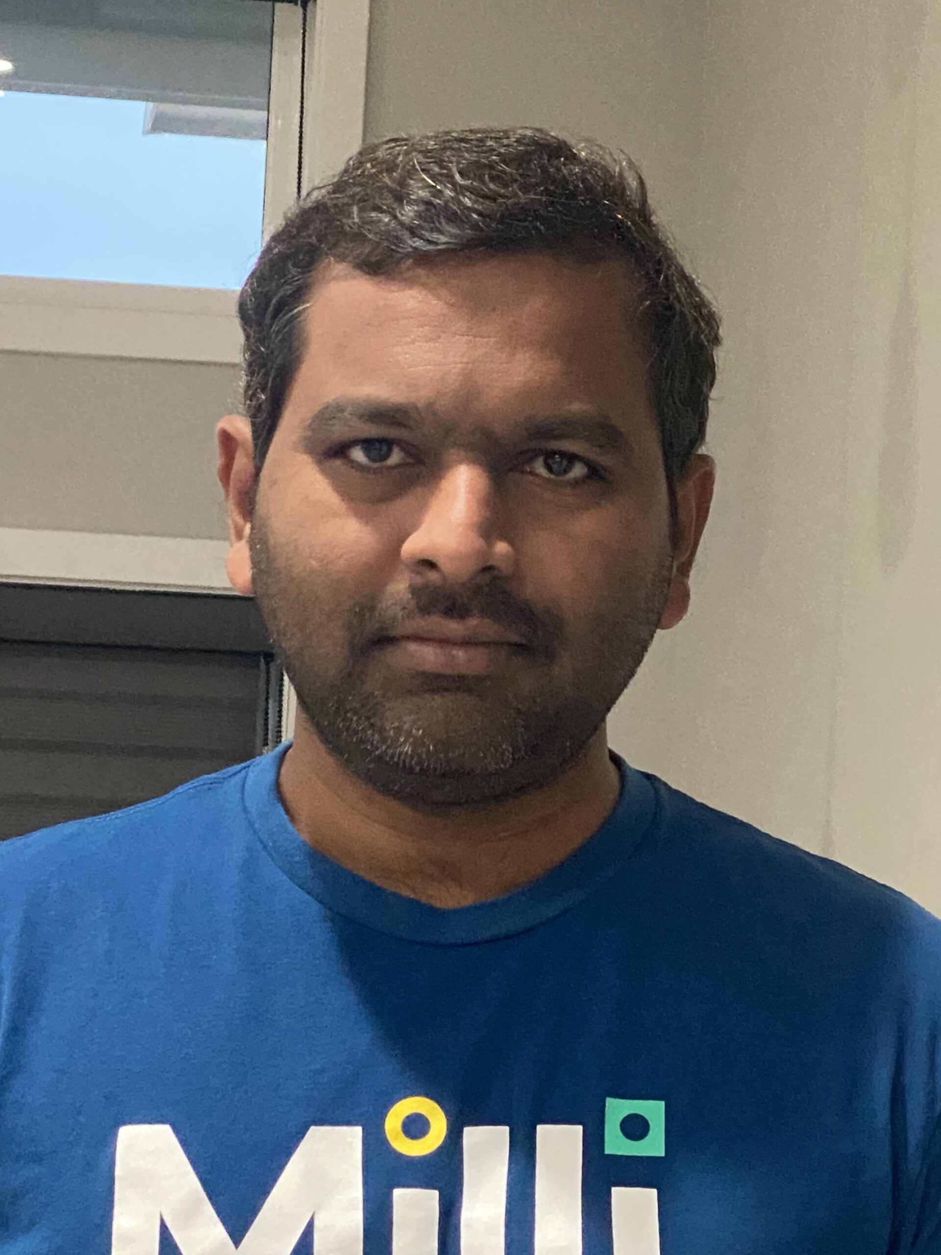 Photo of Sivaramireddy wearing a blue Milli t-shirt