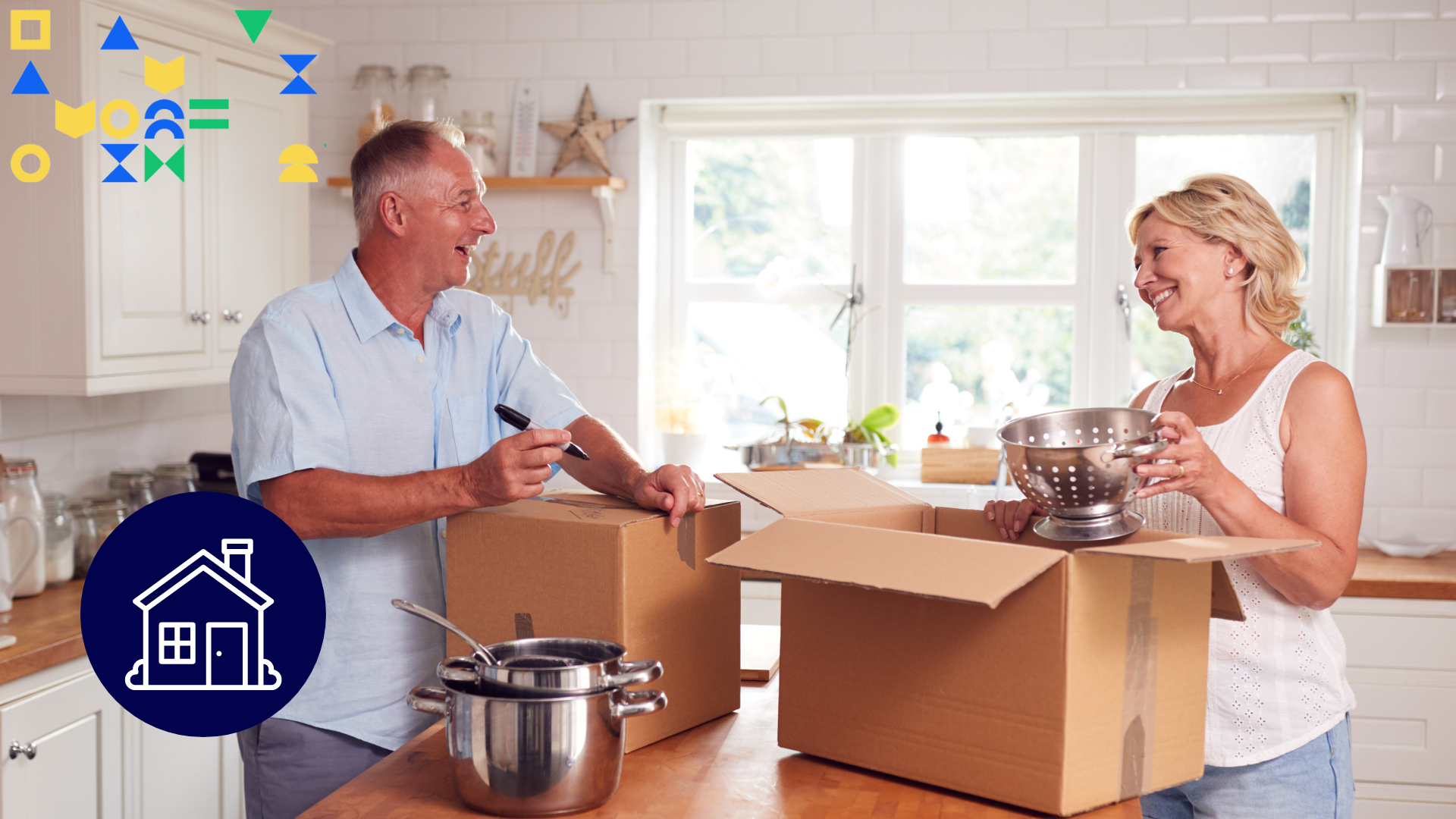 Image of a Gen X couple smiling packing up their kitchen to represent downsizing and making money moves 